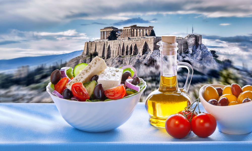 /api/cms/uploads/greece_greek_food_and_Acropolis_behind_b56afffea9.jpg