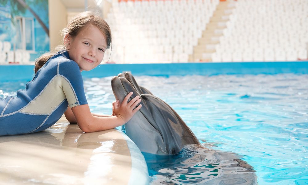 /api/cms/uploads/kid_and_dolphin_cbdc0349b6.jpg